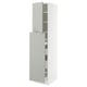 White tall kitchen cabinet with adjustable shelves and grey drawer.