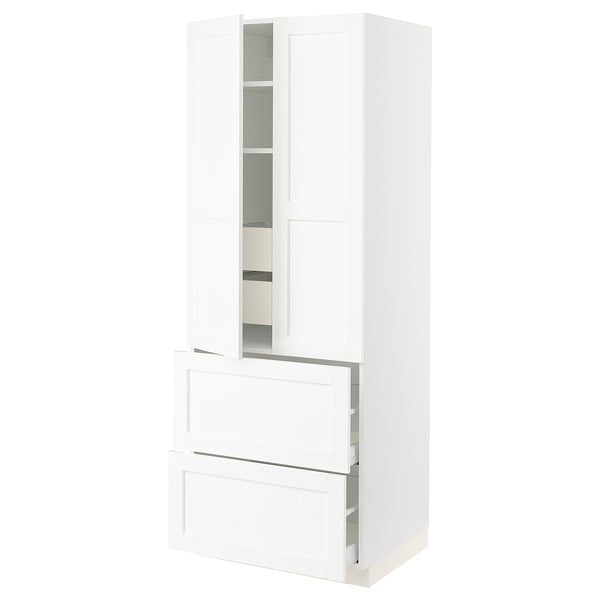 A white SEKTION tall kitchen cabinet with one open door, featuring shelves inside.