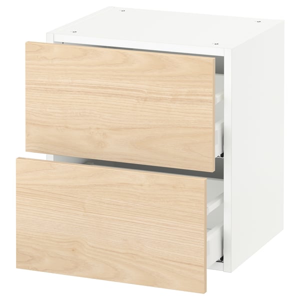 A white SEKTION kitchen unit with light wooden drawers. It two open drawers and a closed cabinet.