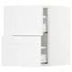 White SEKTION kitchen cabinets. Two upper wall cabinets, two lower drawer units. Modern, minimalist design with smooth fronts.