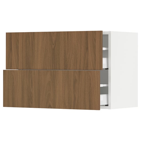 Depicts a modern kitchen cabinet system named SEKTION with wooden walnut fronts, featuring smooth surfaces and a sleek design.