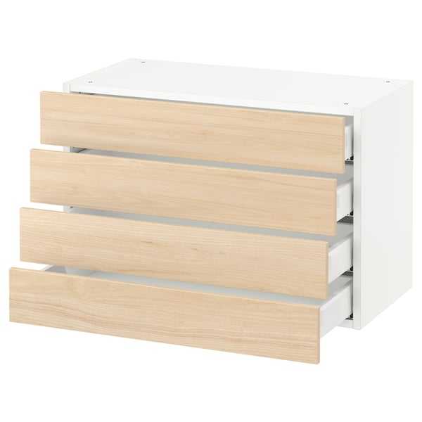 The SEKTION kitchen unit four light ash wooden drawers in a white cabinet. Modern and minimalist design.