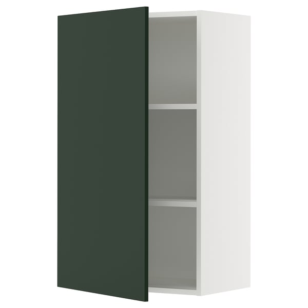 A SEKTION kitchen cabinet with a dark green havstorp door, white frame, two shelves, and a door damper.