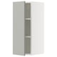 White SEKTION wall cabinet with grey glass shelf.