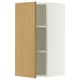 A white SEKTION wall cabinet with an oak veneer door, featuring an adjustable shelf inside.