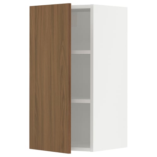 SEKTION kitchen cabinet, white and walnut, one open door revealing adjustable shelves.