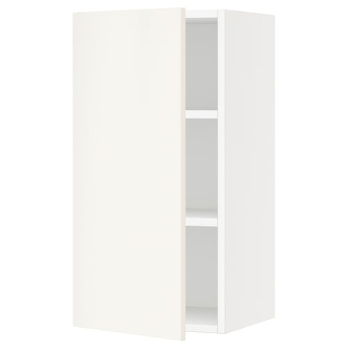 A white SEKTION kitchen wall cabinet with a single adjustable shelf and a door that can open left or right.
