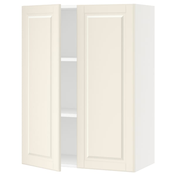 White SEKTION kitchen cabinet with off-white bodbyn doors, featuring bevelled edges and adjustable shelves, mounted on a wall.