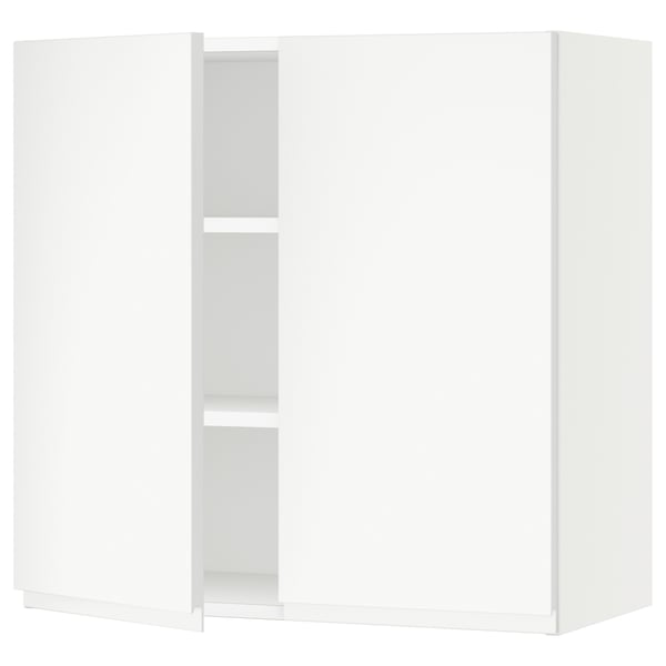 The SEKTION kitchen cabinet in white. Its a modern, minimalist unit with a sleek design and adjustable shelves.