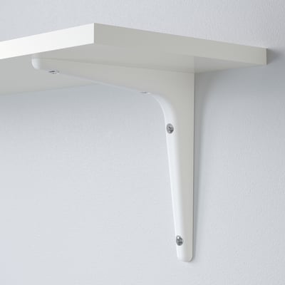 White wall shelf securely mounted with two metal brackets, designed to be stable and unobtrusive.