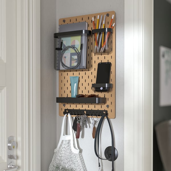 Pegboard organiser with baskets, shelves, hooks, and phone holder for small items. Perfect for home office or entryway.