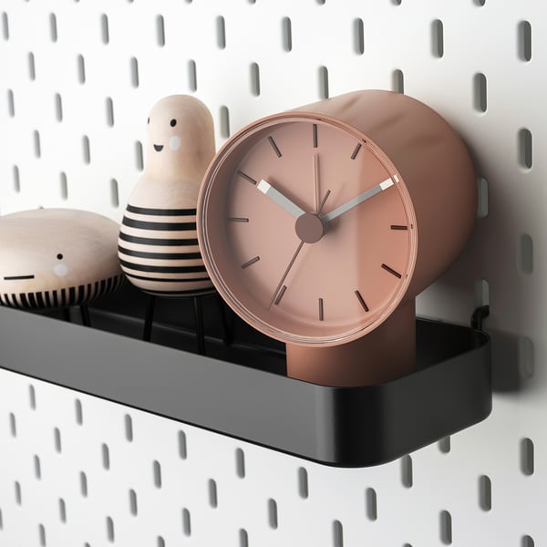Wall-mounted SKÅDIS with clock & toys.