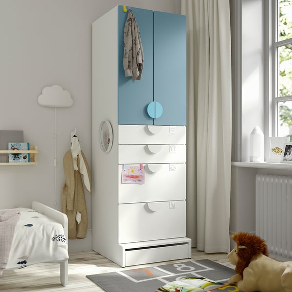 Kids room with tall blue SMÅSTAD wardrobe, toy nearby.