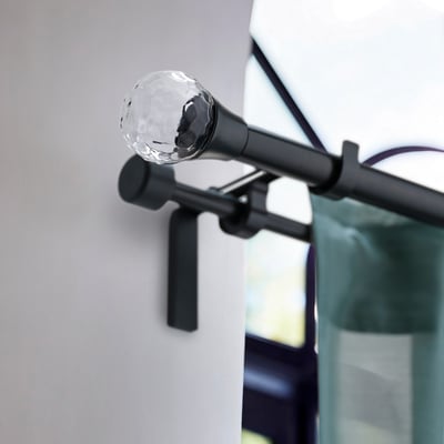 SOLBLOMMOSSA black globe finial on curtain rod, small and sleek.