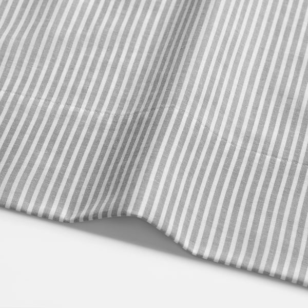 Close-up of grey and white striped cotton fabric, showcasing its smooth texture and even pattern.