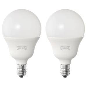 Two white ikea SOLHETTA bulbs side by side, round shape, aluminum base, smooth design.