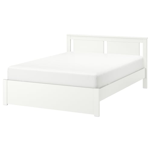 SONGESAND white bed, sleek and modern design with high legs, sturdy fiberboard construction.