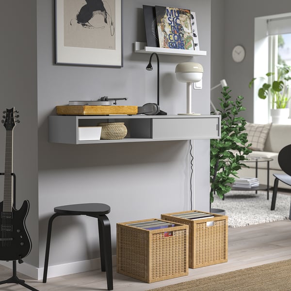 Wall-mounted media shelf, grey, open/closed storage, hides cables.