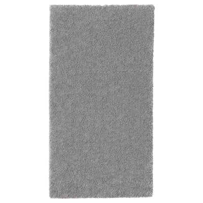 Grey rectangular STOENSE rug with soft, thick pile for comfort and sound dampening.
