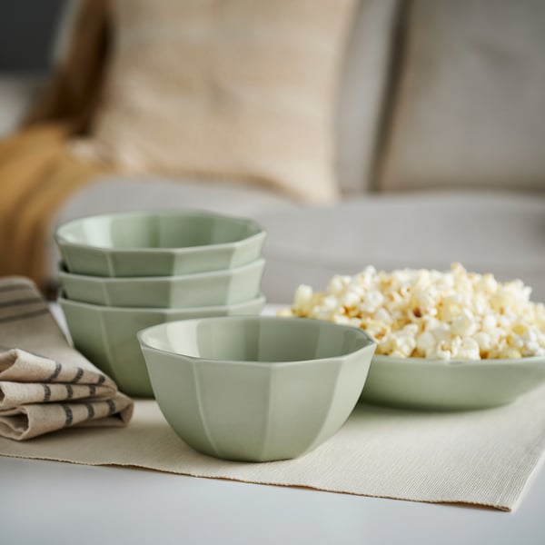 STRIMMIG green bowls; small, square-shaped with ridged design, stacked with popped corn.