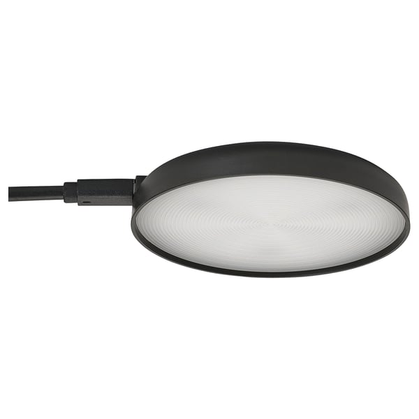Black round STRIMSÄV spotlight with textured glass panel, mountable with gel pad.