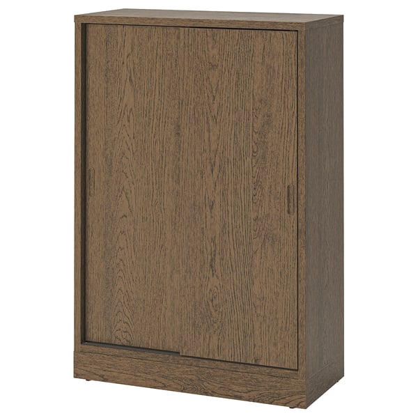 Brown wooden TONSTAD cabinet, sliding doors, adjustable shelves.