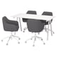 Modern office setup with four grey fabric chairs and a white table.