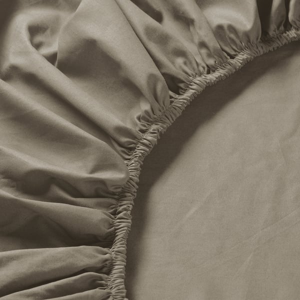 Close-up of luxurious, textured bedsheet. Fine weave, crisp percale, soft matte finish.