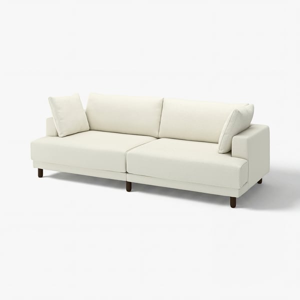 UPPÅKRA sofa, cream, wide and low, plush cushions, wooden legs, inviting and stylish design.
