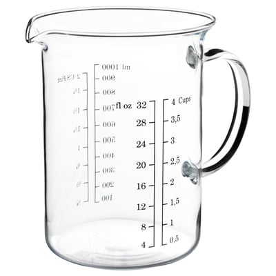 Clear glass measuring jug, black handle, with cup and ounce markings, suitable for baking, microwave and dishwasher safe.