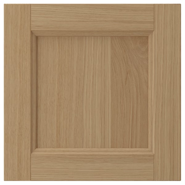VEDHAMN wood cabinet door. Natural oak, square shape, simple panel design.