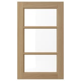 VEDHAMN natural oak kitchen cabinet door with glass panels.