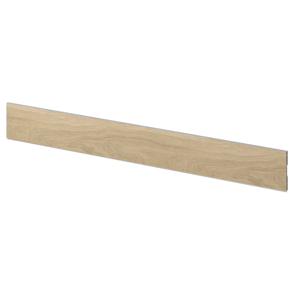 A VEDHAMN oak kitchen plinth. Its beige, rectangular, and has a wooden texture.