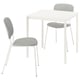 A small, white VIHALS dining set. It includes a square table and two chairs with grey, padded seats and backs. The design is modern and minimalist.