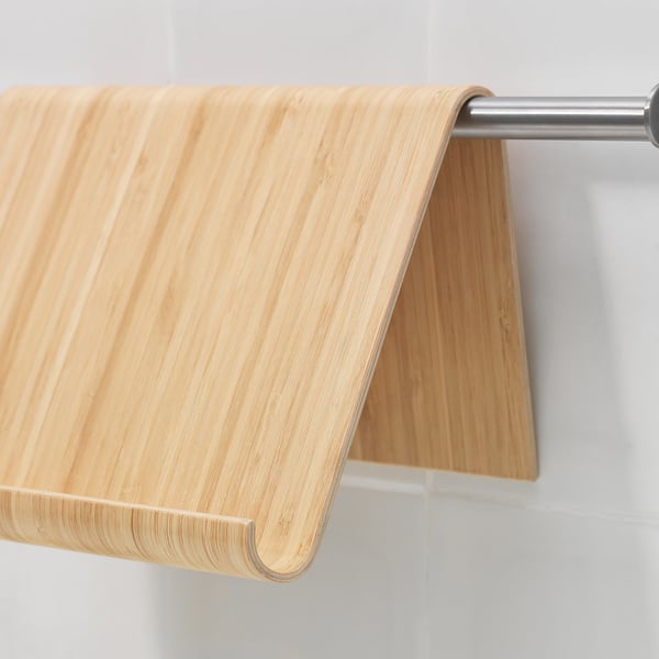 Wooden stand hangs securely on metal rod, ideal for holding books or tablets, showcasing quality craftsmanship and sturdy design.