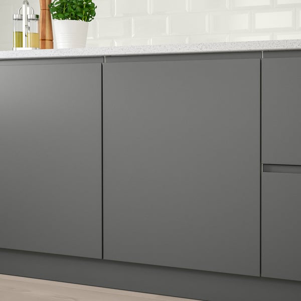 Kitchen cabinets with minimalist design, grey matte finish, and integrated handles for modern look.