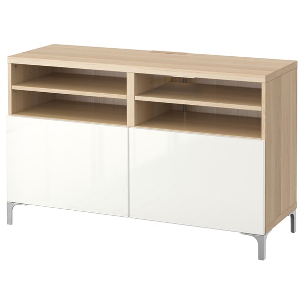 A light-colored wooden tv stand with white storage and open shelves.