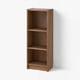 A BILLY bookcase, a tall, wooden, brown bookshelf with three empty, adjustable shelves against a white wall.