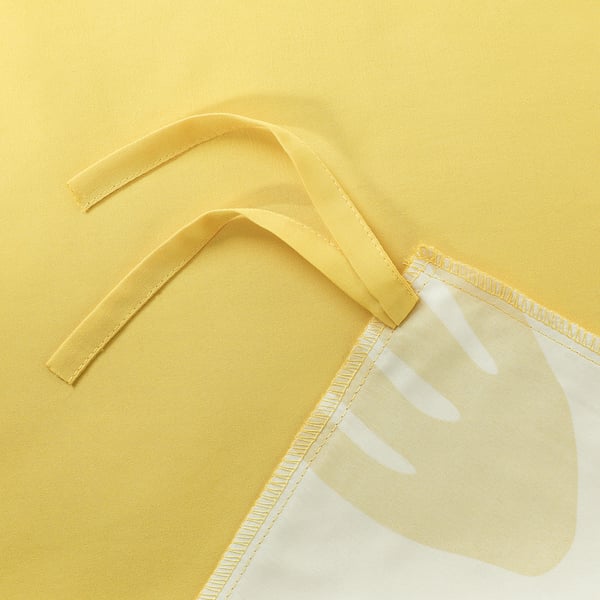 Yellow bed sheets corner with ties and tag.