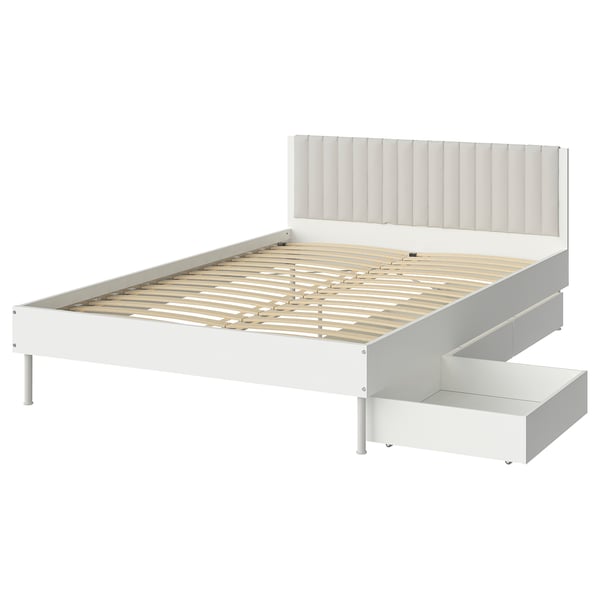 White BRUKSVARA bed frame with padded headboard, wooden slats, and under-bed storage.
