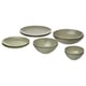 Six olive-green dishes, three plates, and three bowls of varying sizes, all in a sleek minimalist design, arranged in a stack.