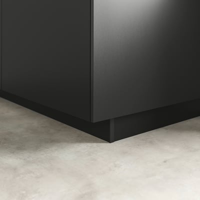 Black kitchen plinth, blending cabinets with floor, sleek & modern.