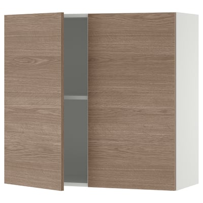 A KNOXHULT wooden wall cabinet in a light brown colour with one grey shelf, designed for kitchen storage.
