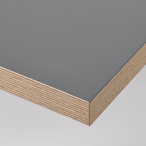 Modern grey desk with sleek, glossy top and sturdy wooden edge. Ideal for a clean, organised workspace.