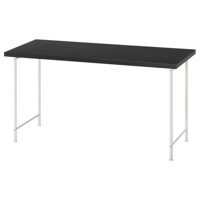 A LAGKAPTEN black office desk with silver metal legs.