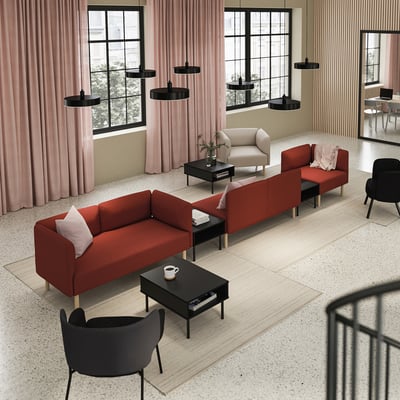 Modern living room with red LILLEHEM modular sofa, black chairs, coffee tables, pink curtains, large windows, black pendant lights.