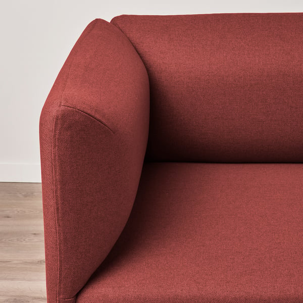 Dark red modular sofa section, showing plush, angular armrest and backrest. Quality fabric, robust and stylish.