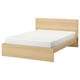 A modern wooden bed called MALM. Light oak, rectangular shape, high headboard, clean design.