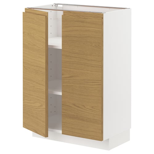 A white METOD kitchen cabinet with oak-finished doors and integrated handles.