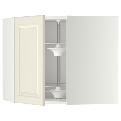 A cream-colored METOD kitchen cabinet with a glass carousel and adjustable shelves.